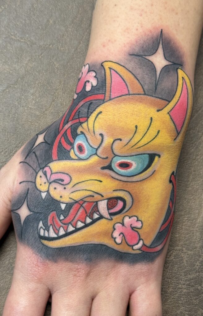 Japanese kitsune mask hand tattoo bright color