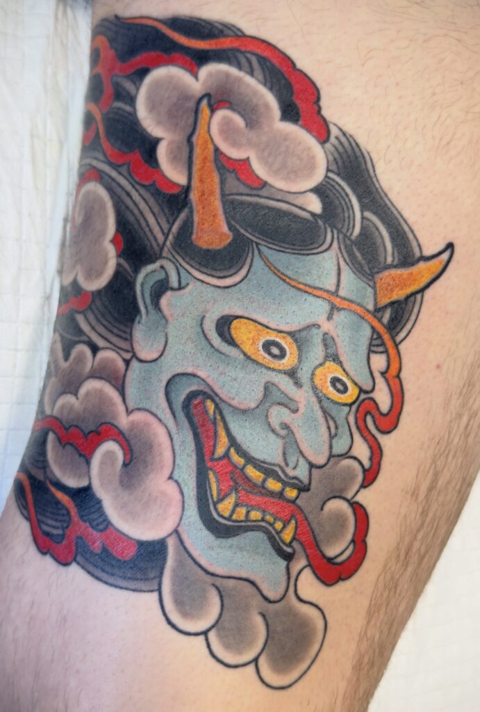 Japanese style hannya demon mask tattoo clouds flames color