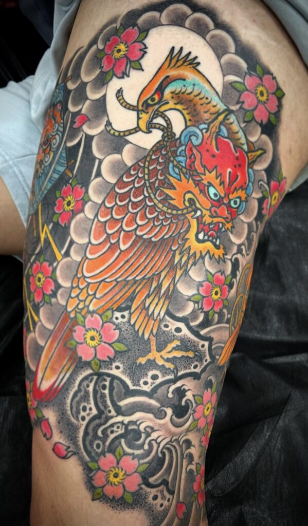 Japanese style hawk tattoo oni mask color waves clouds traditional background