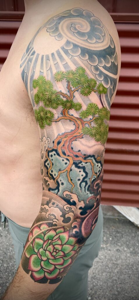 Traditional Japanese sleeve tattoo bonsai tree waves clouds