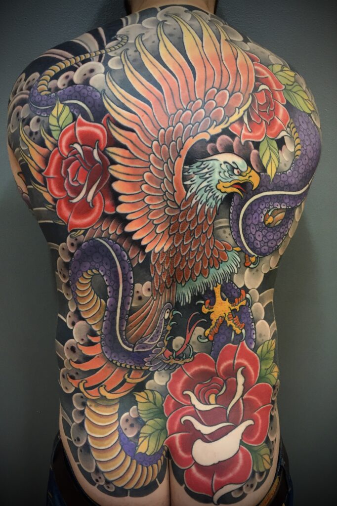 Traditional Japanese American back piece tattoo eagle snake roses color